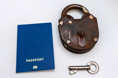 passport and padlock on a white background. travel concept.の写真素材