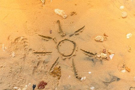 Sun painted on the sandy beach