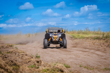 UTV buggy and 4x4 off road vehicle in a sandy track. Buggy extreme riding