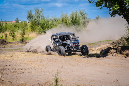 UTV vehicle offroad kicking up sand on a dune. Extreme, adrenalin. 4x4.の写真素材