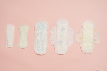 Different feminine sanitary napkins (sanitary pads) on a pink backgroundの写真素材