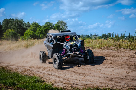 ATV and UTV riding in a sandy dusty track. Amateur competitions. 4x4.の写真素材