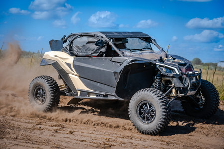 ATV and UTV riding in a sandy dusty track. Amateur competitions. 4x4.の写真素材