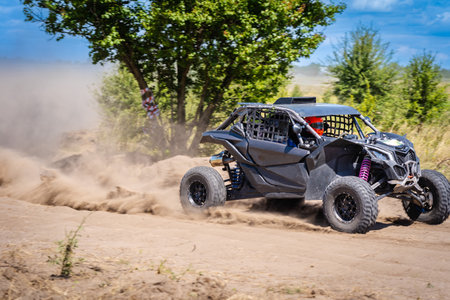 Cool view on hard ride UTV on a sandy track. 4x4, extreme, adrenalin.の写真素材