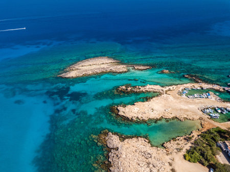 Aerial view from flying drone on clear blue water of bay in Cyprusの写真素材