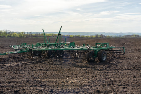 Seedbed cultivator on a field on a spring morning.