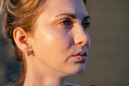 Close up on lips of a girl with herpes. Beauty dermatology conceptの写真素材