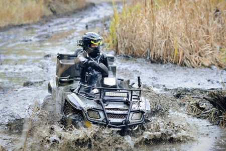 ATV, buggy, quad and UTV offroad vehicle racing in a hard track with mud splash. Extreme, adrenalin. 4x4の写真素材