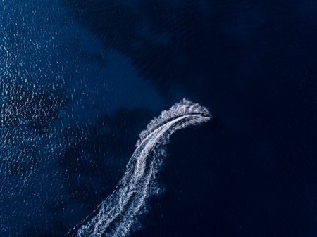 Aerial view on jetski in tropical blue watersの写真素材