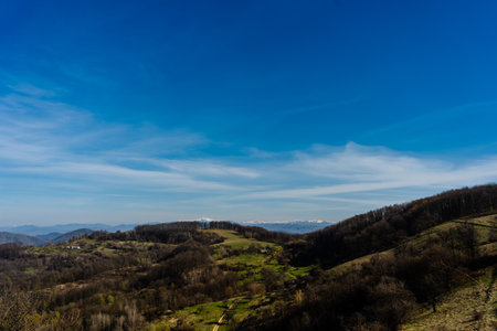 Wonderful view on green hills and mountains. Rural scenery on rolling hillsの写真素材