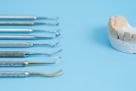 Dentist tool set. Teethcare, dental health concept. Blue background top view copy spaceの写真素材