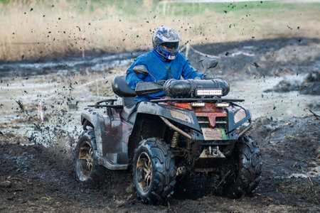 ATV, UTV, buggy, 4x4 off-road vehicle in the muddy water. Extreme, adrenalinの写真素材