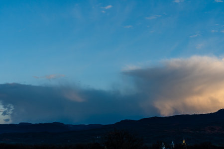 Beautiful clouds in sky over valley hills
