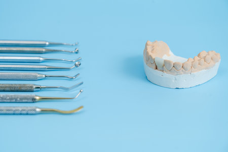 Dentist tool set. Teethcare, dental health concept. Blue background top view copy spaceの写真素材