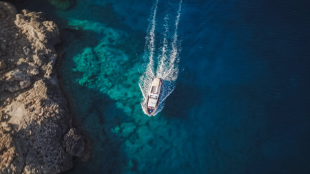 Top view from drone of speed boat in the blue waterの写真素材