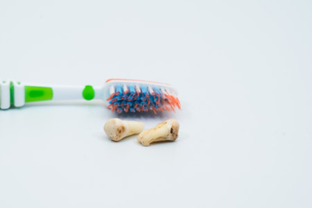 Damaged caries teeth with toothbrush on white background