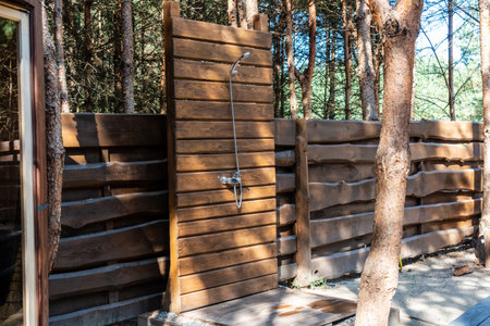 View on modern outdoor shower in forest garden. A Summer shower cabinの写真素材