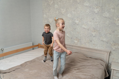 Smiling family plays with kids. Happy family momentsの写真素材