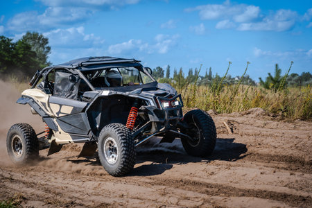 ATV, UTV, buggy, rally riding in a dusty track. Amateur competitions