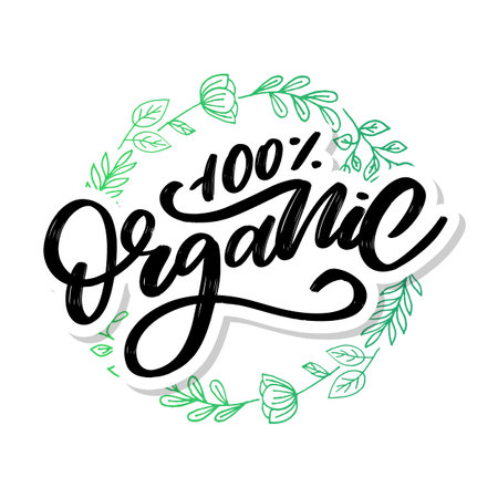 Organic brush lettering. Hand drawn word organic with green leaves.のイラスト素材