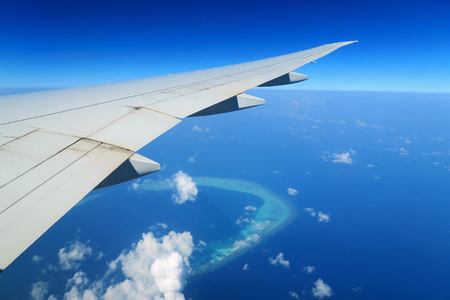 Maldives islands top view and airplane wingの写真素材
