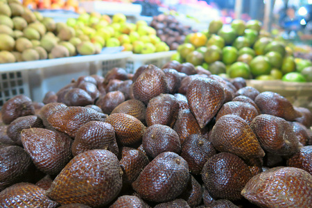 Tropical fruits local market: snake fruit, apples and mandarines. Bali, Indonesiaの写真素材