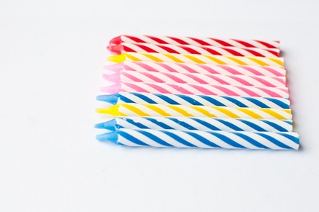 colorful birthday candles on white