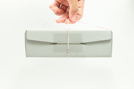 Hand looped ropes parcel box on white background.の写真素材