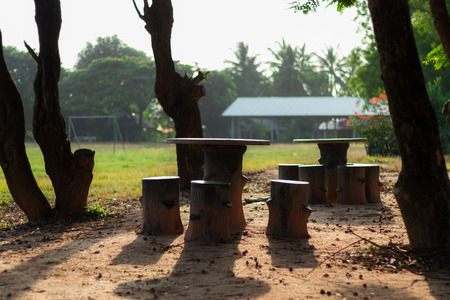 Old ceramic table set for sitting under the trees and shaded from during the morning.