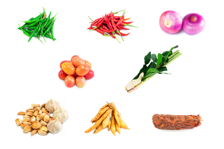 Top view and merging. Spices fresh vegetables set for cooking. Isolated on white background.の写真素材
