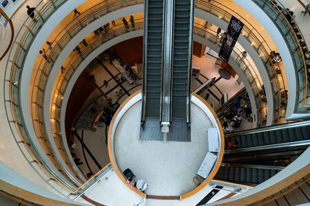 Bangkok Art and Culture Centre, Bangkok, Thailand-August 11.2019. Low light and top view of interior design the building spiral of class. There is gap and escalators in middle from below to top end.のeditorial素材