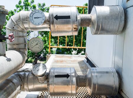 The pressure gauge dial installed to the pipe wrapped with galvanized insulation. To control the...