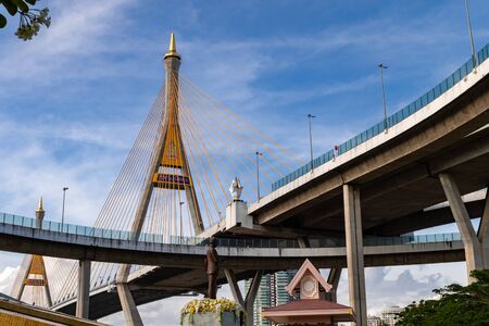 Bhumibol Bridge, Samut Prakan, Thailand-August 18.2019. Monument statue on Multipurpose yard. The gardens under bridge. People are popular to relax and exercise. In the public park.のeditorial素材