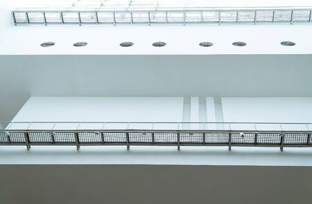 Overexposed view. Ceiling there are vents and receiving light inside the building.