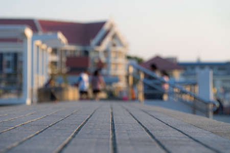 Close up view and copy space of concrete floor. The field was divided into equal in the multipurpose yard of public places. Blurry building background during the evening.の写真素材