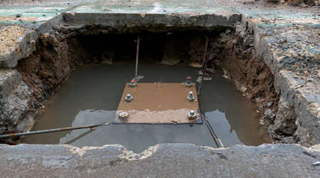 Parts of steel wire structure were in pit underground be flooded from rainy. For the foundation of pillar.の写真素材