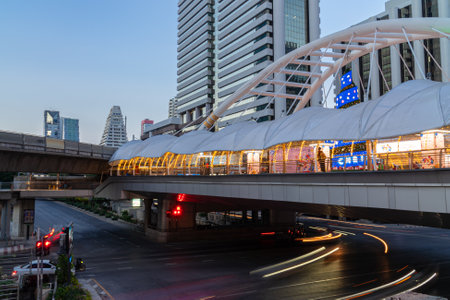 Chong Nonsi Intersection, Bangkok, Thailand-December 31.2021. Long exposure twilight of vehicle on...