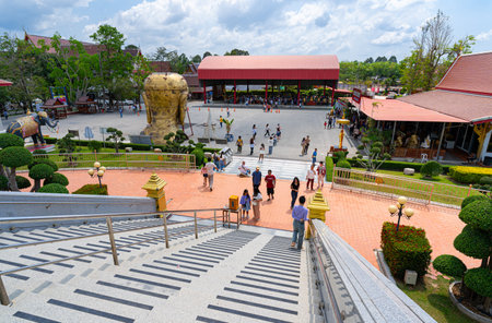 Wat Lahan Rai, Rayong, Thailand-February 24.2024. The large golden statue of a monk is popular with people and tourists. Who come to worship and pray for blessing.のeditorial素材
