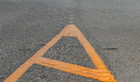 An area where drivers of all types of vehicles are prohibited. Which prohibits drivers from entering the Painted Medians area. Paint yellow on the road.の写真素材