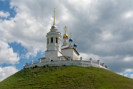 An ancient monastery standing on a high hill.