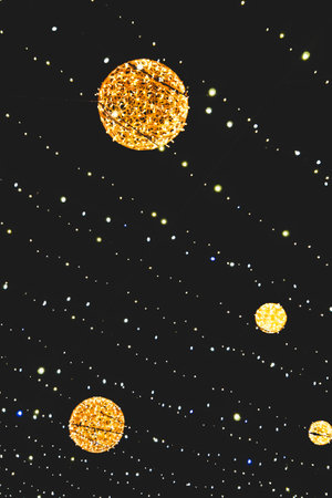 close up picture of decorating light balls in the sky on black background, as Christmas card....