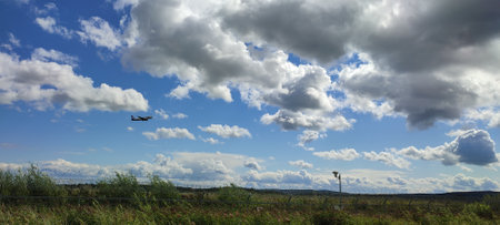 An airplane against a clear blue sky on a sunny day.