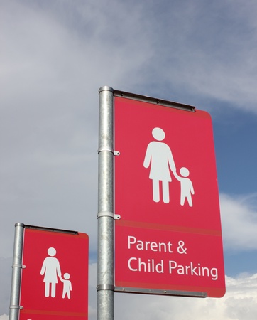 A Parent   child parking sign for parents who drive and require parkingの写真素材