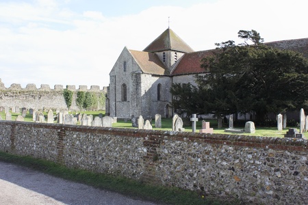 A church and graveyard within the walls of a medieval castleの写真素材