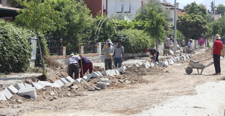 Turkish workmen repairing the roads and pavements,Turkey,calis,31st may 2013のeditorial素材