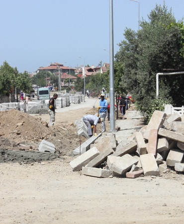 Turkish workmen repairing the roads and pavements,Turkey,calis,31st may 2013のeditorial素材
