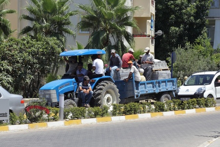 A tractor carrying many passengers through the streets of Turkey, 2013のeditorial素材