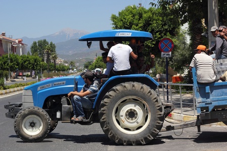 A tractor carrying many passengers through the streets of Turkey, 2013のeditorial素材