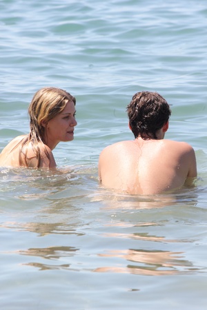 TURKEY,KATRANCI BAY,AUGUST 2013 - A young couple in the sea while on vacationのeditorial素材