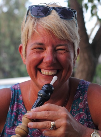 Lady smoking a hookah water pipe in Turkey, July 2013